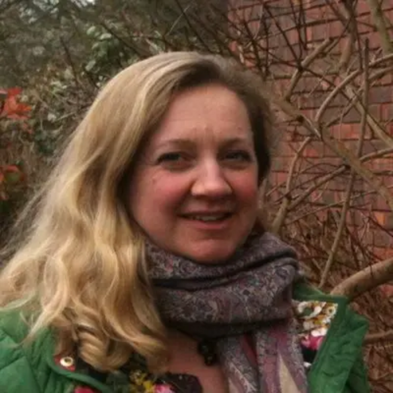 Head and shoulders picture of Lucy Nethsingha wearing green coat and woollen scarf