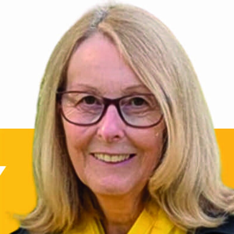 Head and shoulders photo of Jacqui Morley wearing yellow scarf